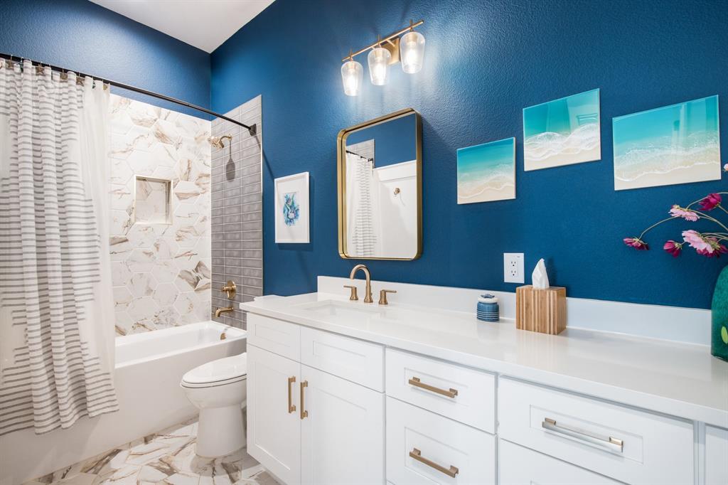 2093 Holt Way Grapevine, TX 76051 - Photo 27 of 40 a bathroom with a sink a toilet and shower