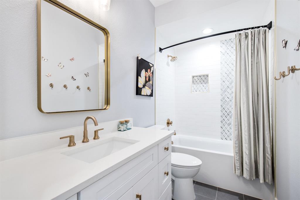 2093 Holt Way Grapevine, TX 76051 - Photo 29 of 40 a bathroom with a sink a toilet and shower