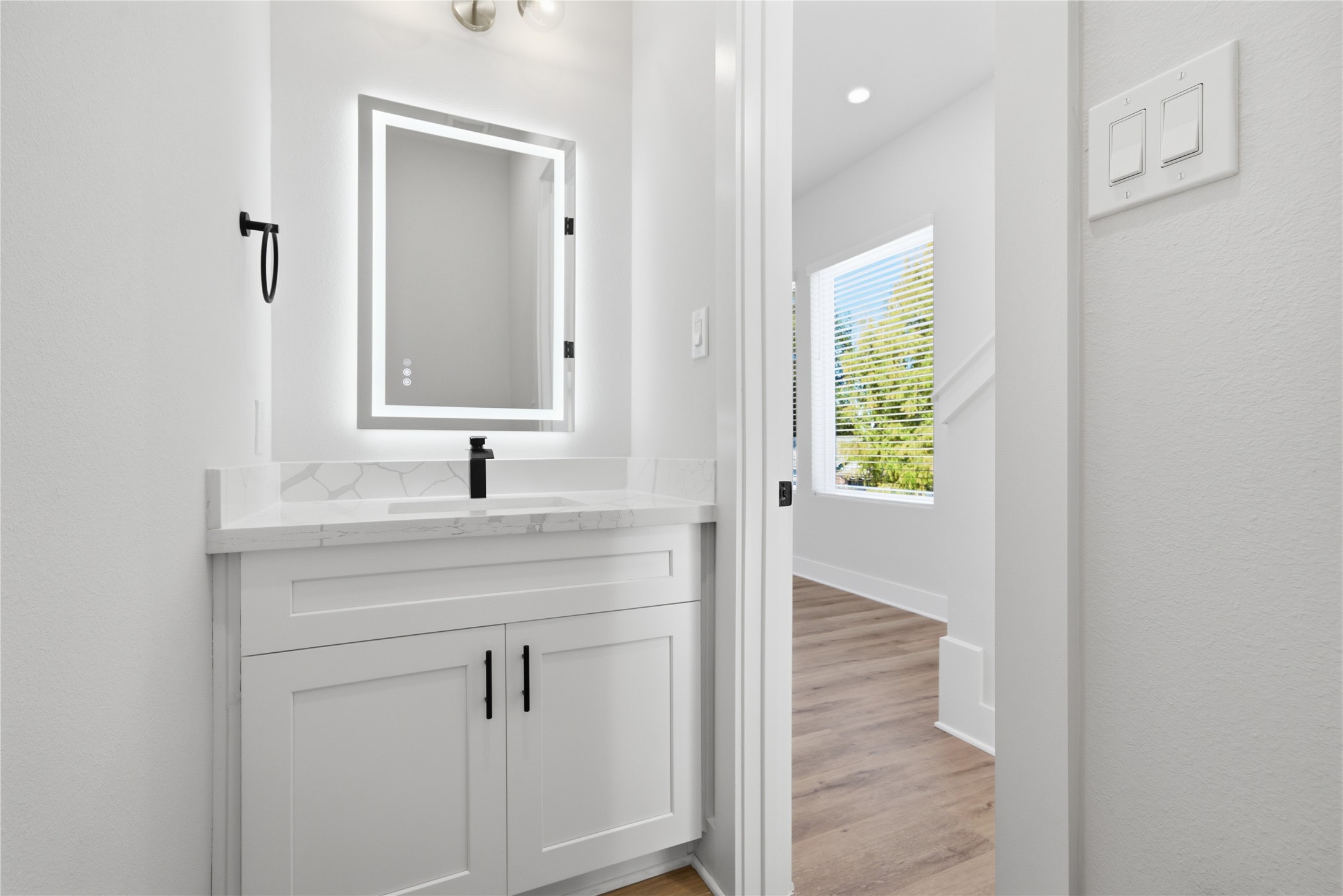 10929 Ivyridge Road, Unit B Houston, TX 77043 - Photo 14 of 37 a bathroom with a sink and a mirror