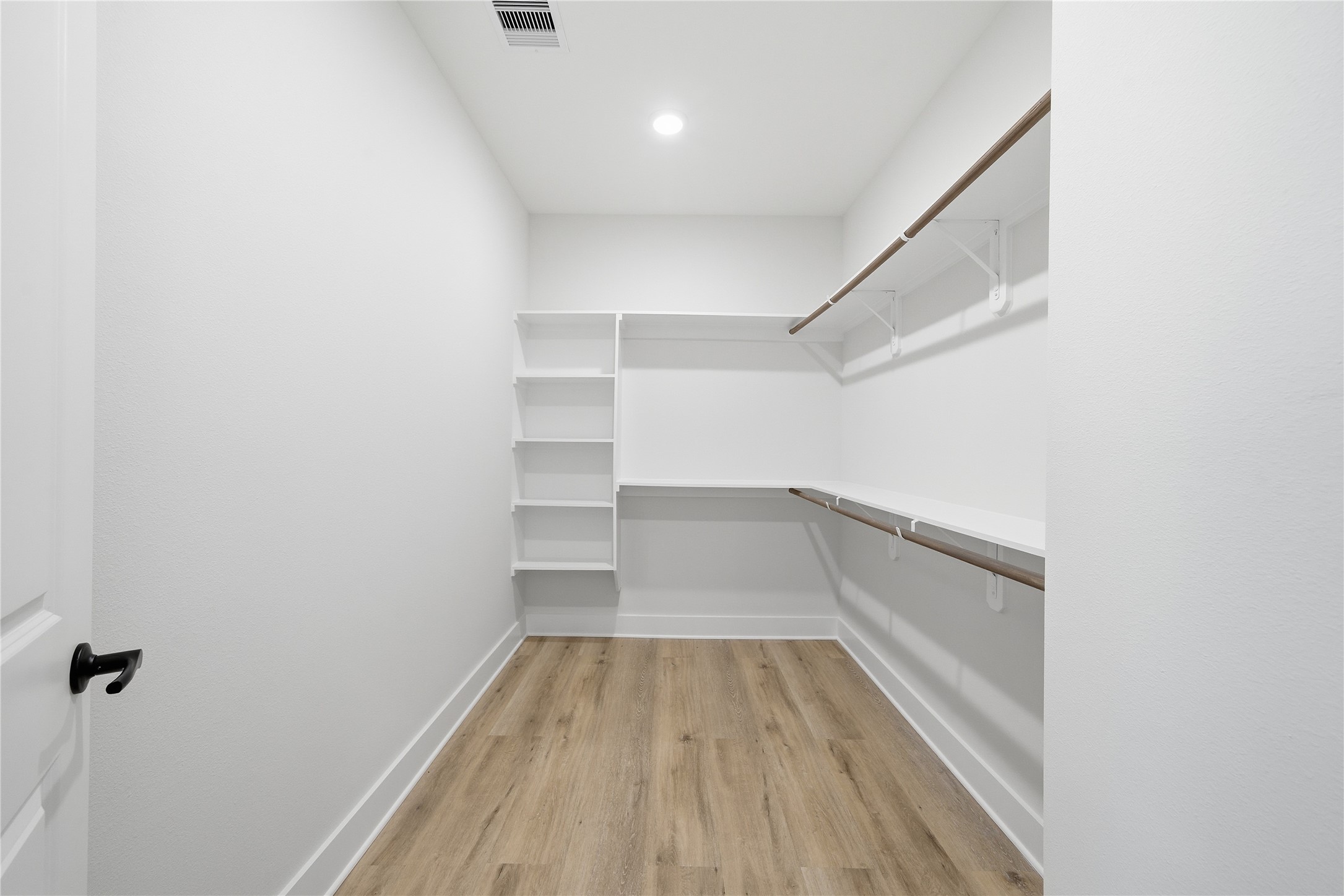 10929 Ivyridge Road, Unit B Houston, TX 77043 - Photo 16 of 37 a view of a room with wooden floor and staircase