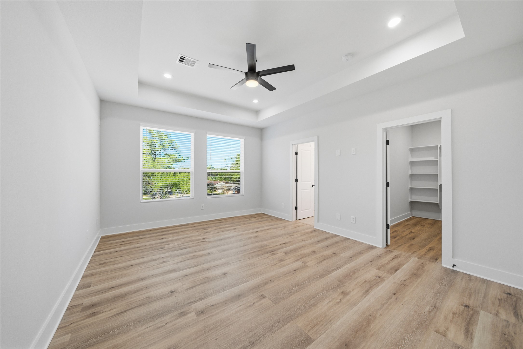 10929 Ivyridge Road, Unit B Houston, TX 77043 - Photo 20 of 37 wooden floor in an empty room with a window