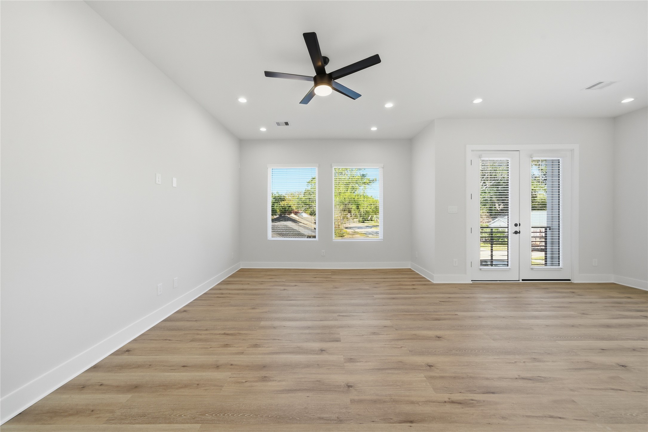 10929 Ivyridge Road, Unit B Houston, TX 77043 - Photo 22 of 37 wooden floor in an empty room with a window