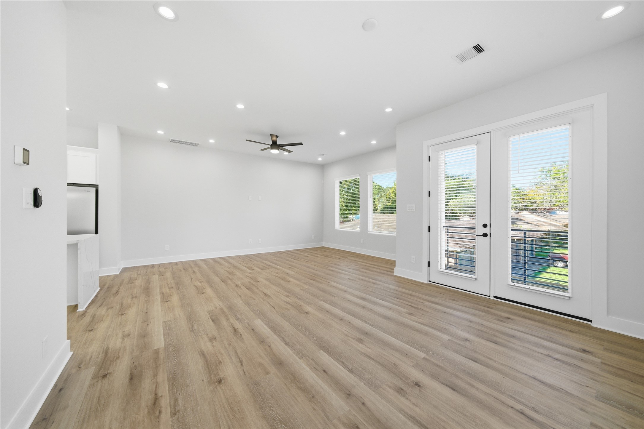 10929 Ivyridge Road, Unit B Houston, TX 77043 - Photo 24 of 37 an empty room with wooden floor and windows