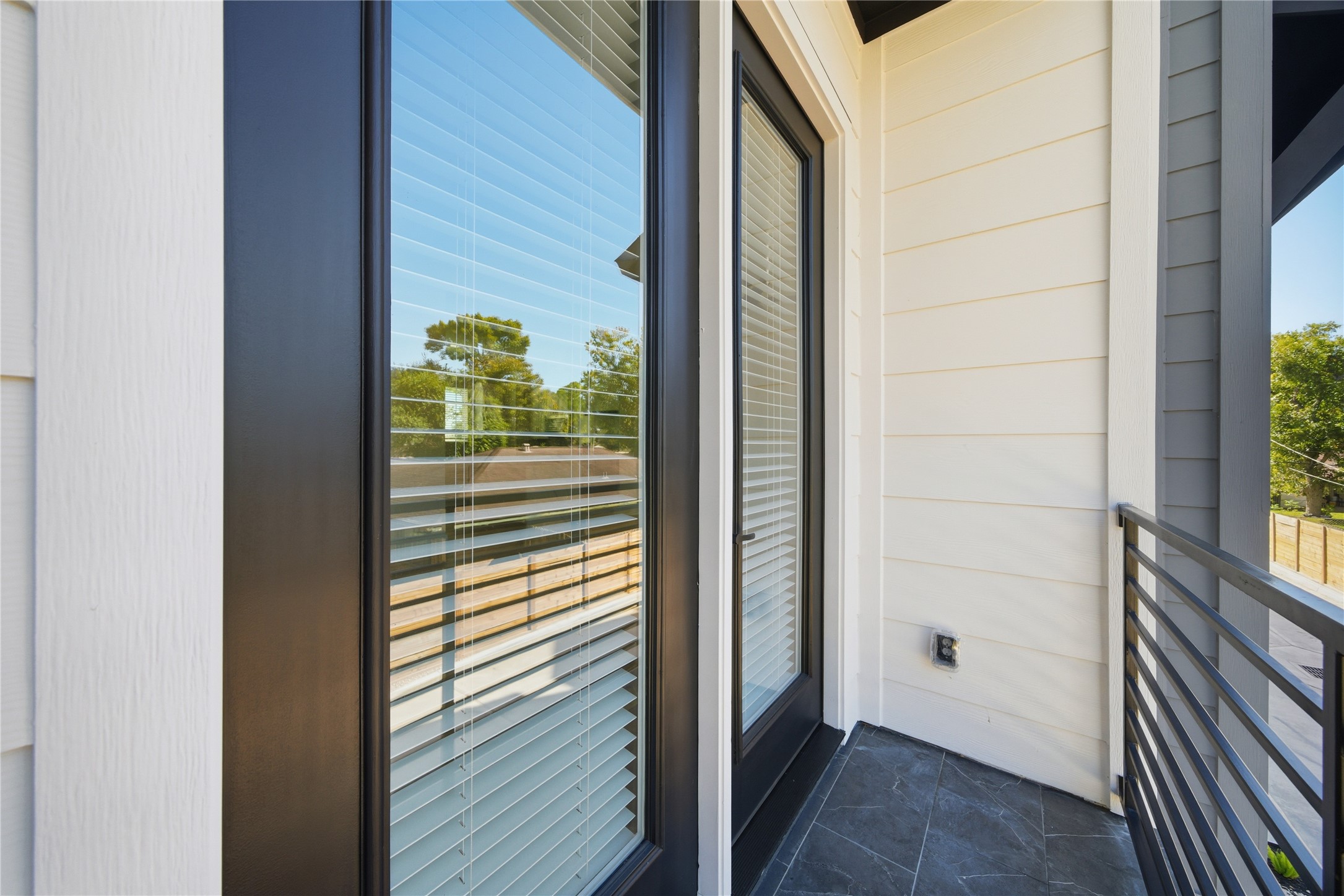 10929 Ivyridge Road, Unit B Houston, TX 77043 - Photo 26 of 37 a view of a door and wooden floor