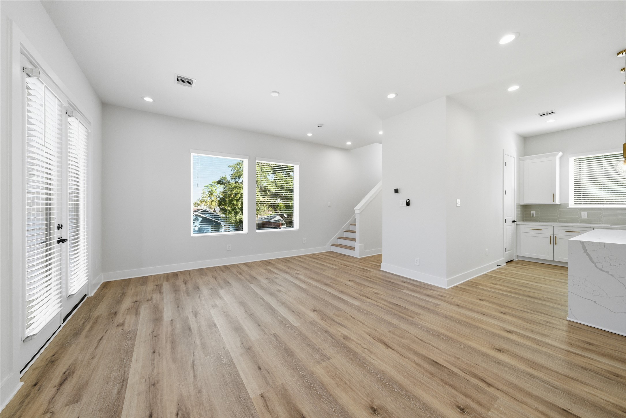 10929 Ivyridge Road, Unit B Houston, TX 77043 - Photo 31 of 37 an empty room with wooden floor and windows