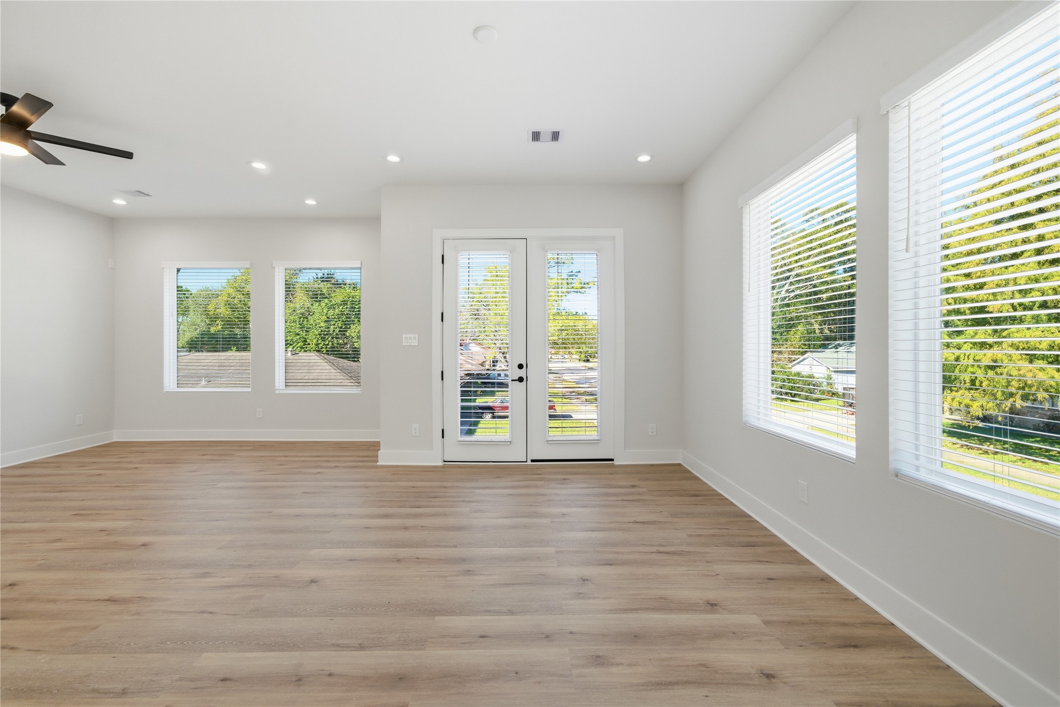10929 Ivyridge Road, Unit B Houston, TX 77043 - Photo 37 of 37 a view of an empty room with wooden floor and a window