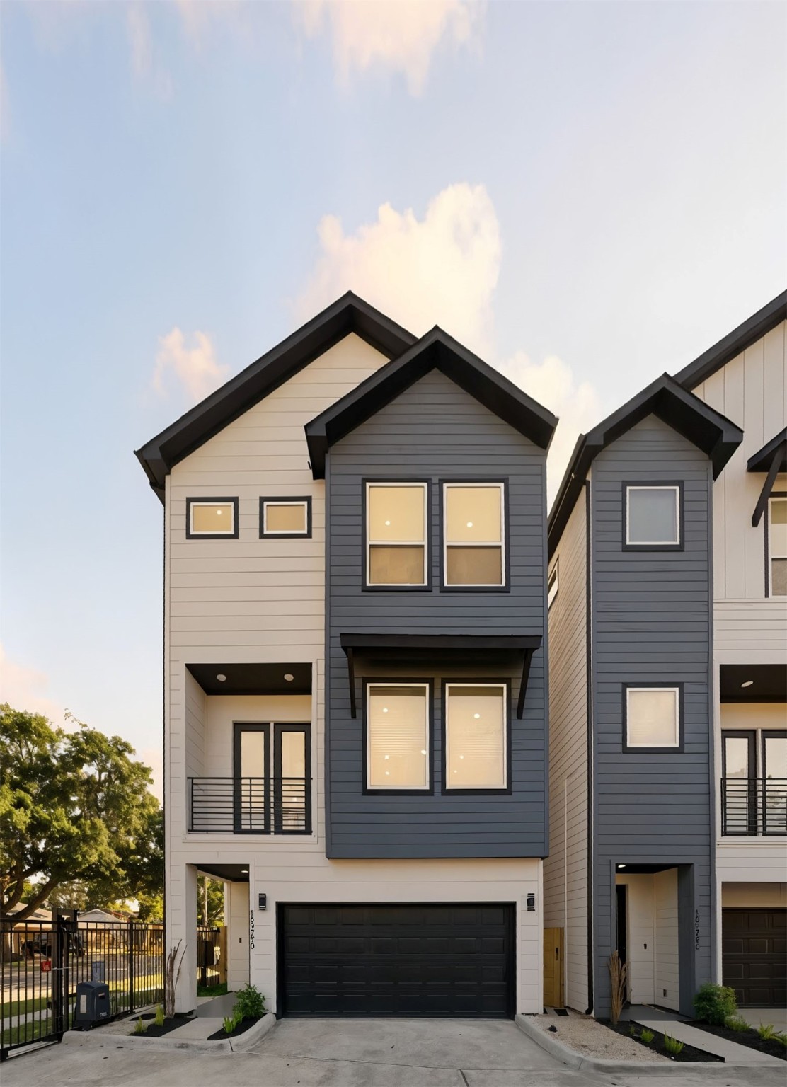 10929 Ivyridge Road, Unit B Houston, TX 77043 - Photo 5 of 37 a front view of a residential apartment building with a yard
