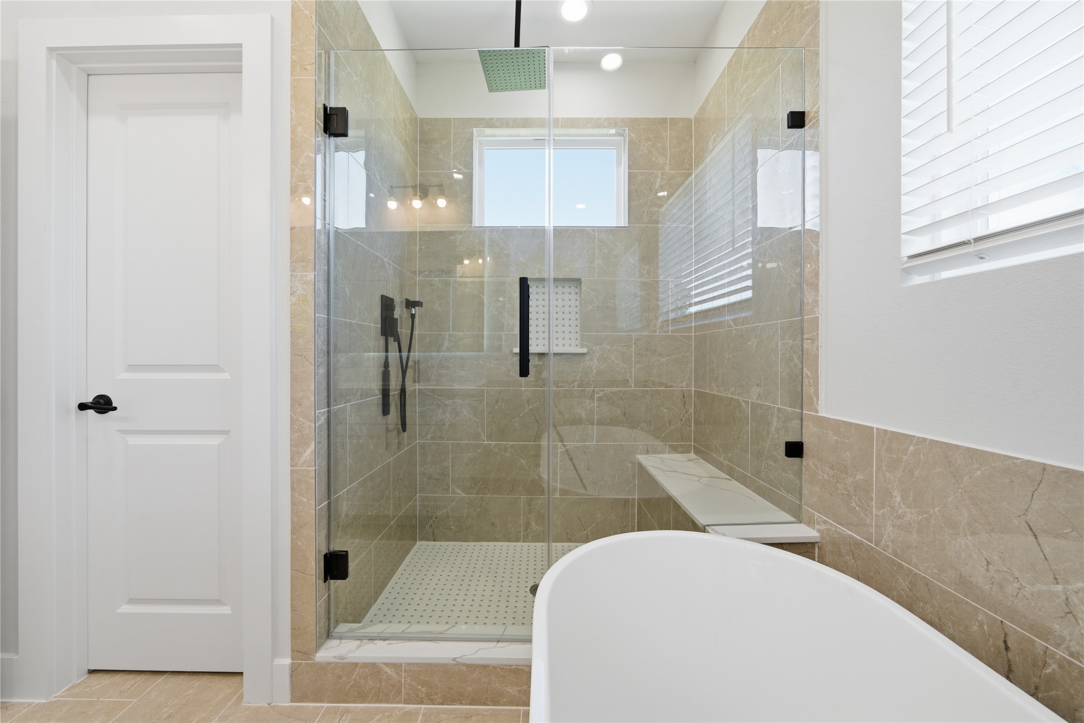 10929 Ivyridge Road, Unit B Houston, TX 77043 - Photo 9 of 37 a bathroom with a tub and shower