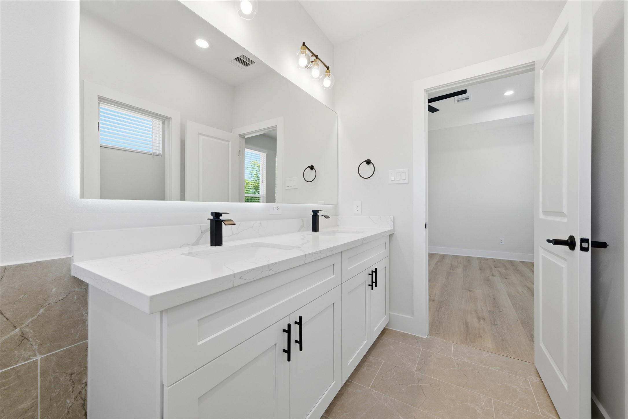 10929 Ivyridge Road, Unit B Houston, TX 77043 - Photo 10 of 37 a spacious bathroom with a double vanity sink mirror and double