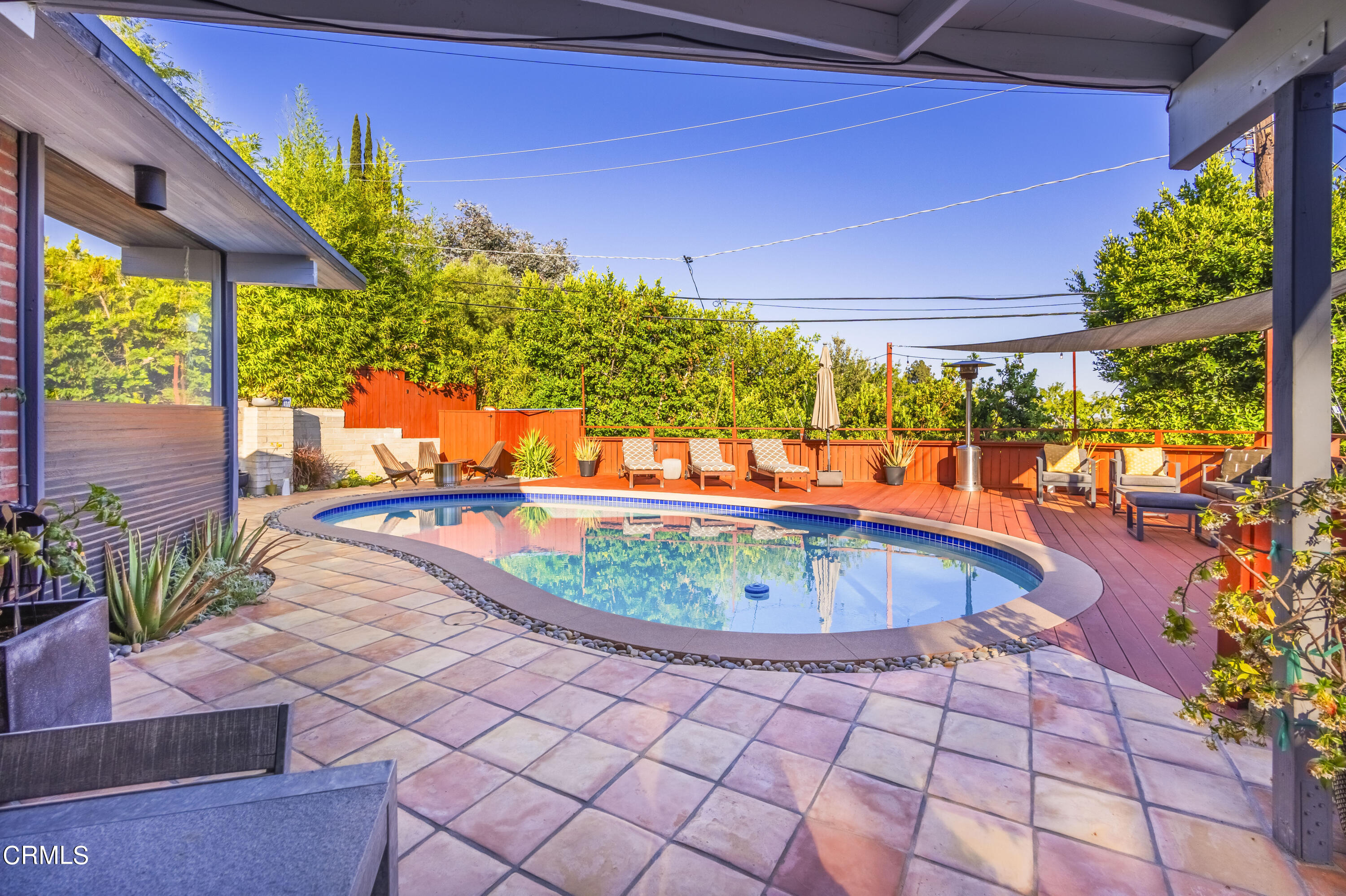 444 Sequoia Drive Pasadena, CA 91105 - Photo 12 of 38 a view of a swimming pool with a patio