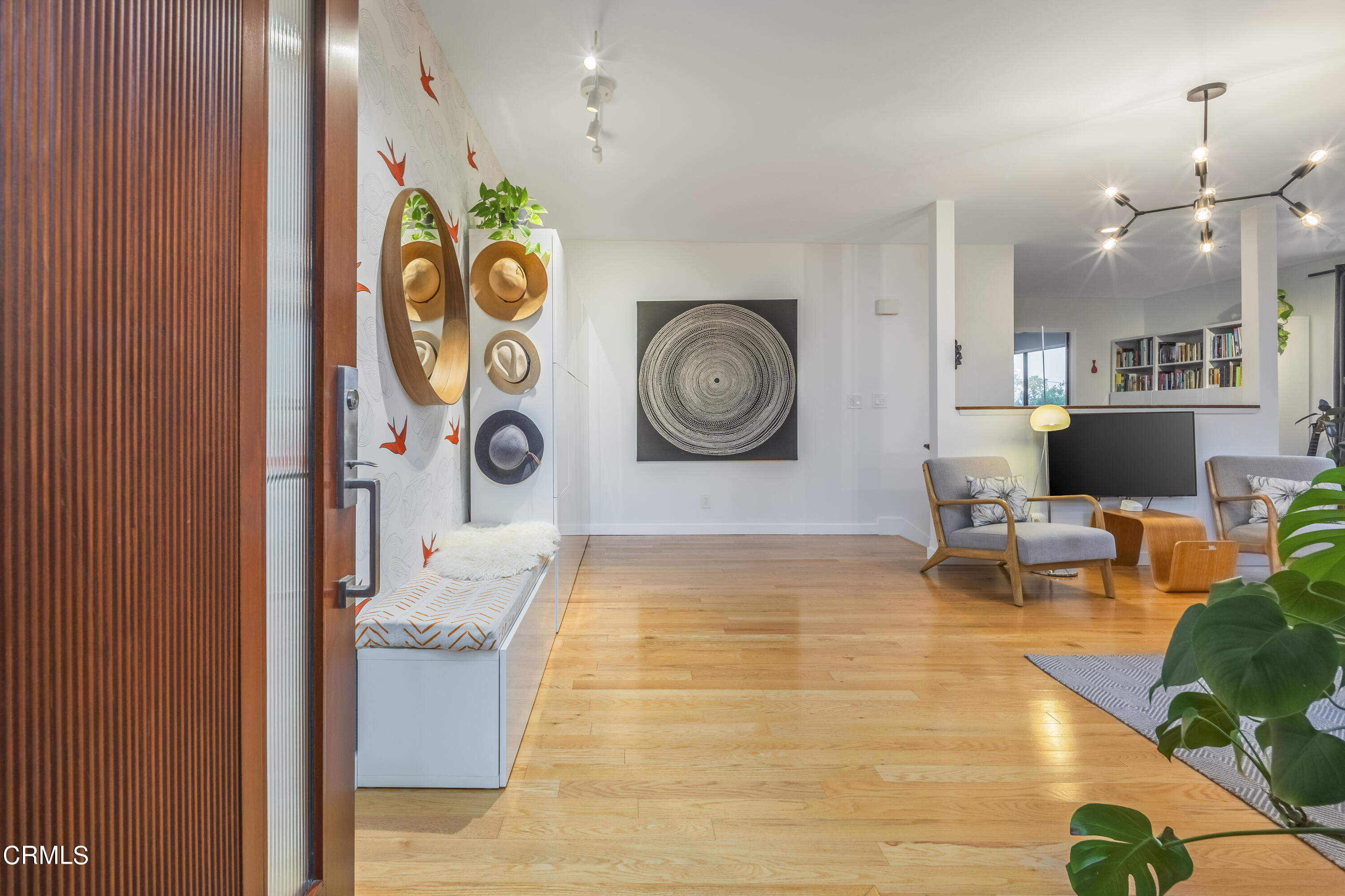 444 Sequoia Drive Pasadena, CA 91105 - Photo 20 of 38 a living room with a table and a clock