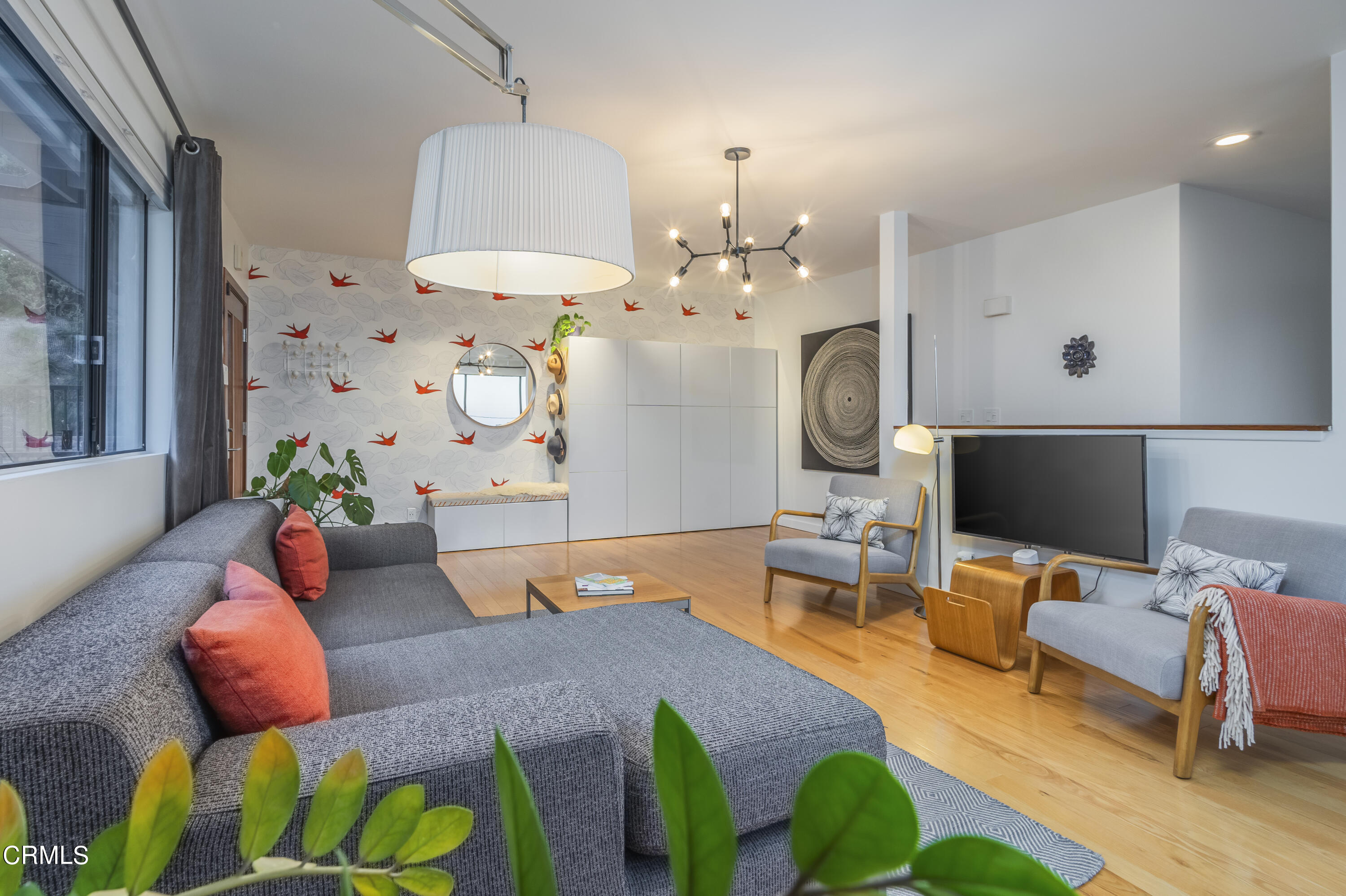 444 Sequoia Drive Pasadena, CA 91105 - Photo 25 of 38 a living room with furniture a chandelier and a flat screen tv