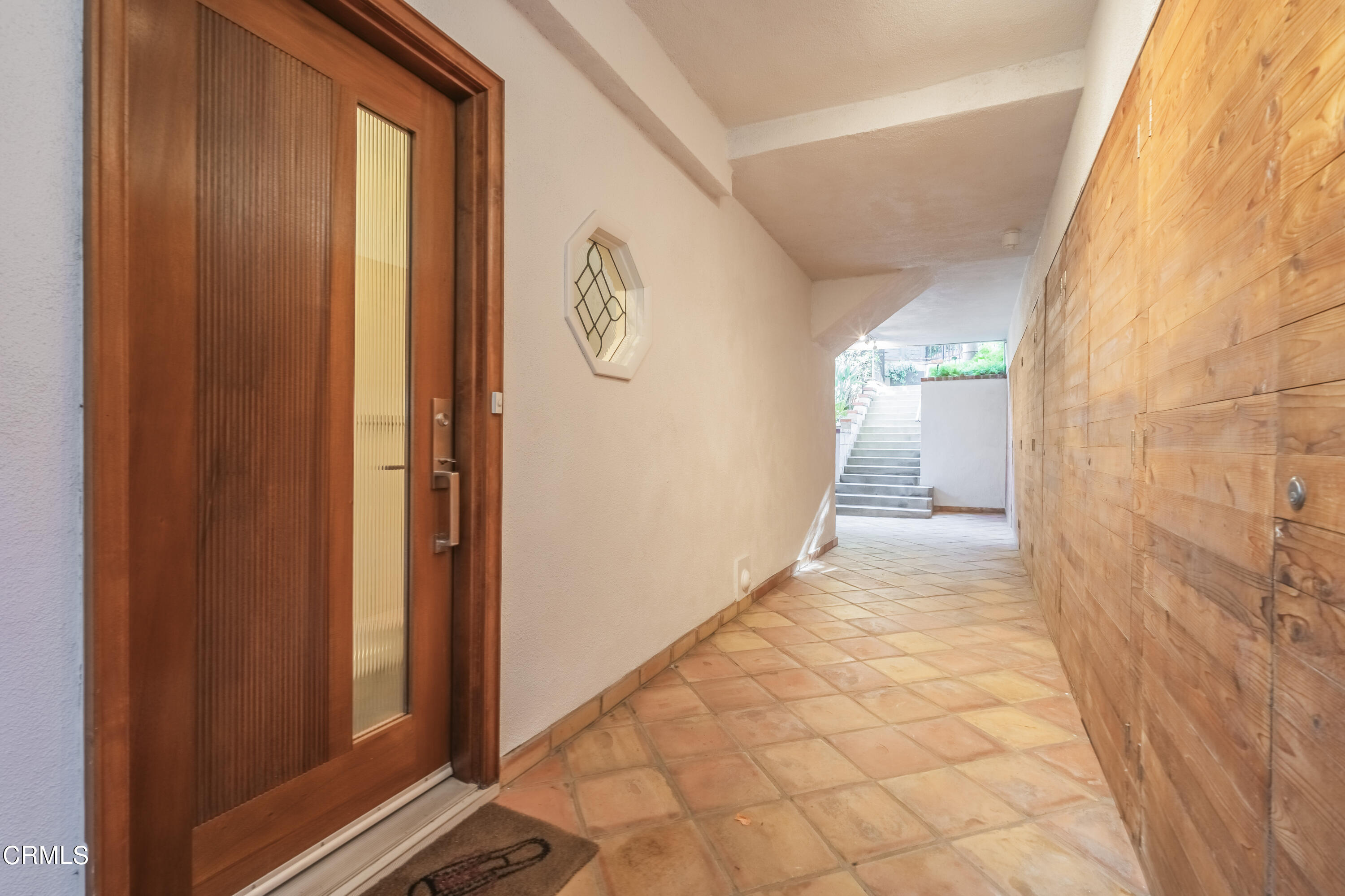 444 Sequoia Drive Pasadena, CA 91105 - Photo 33 of 38 a view of a hallway with wooden floor and a bathroom