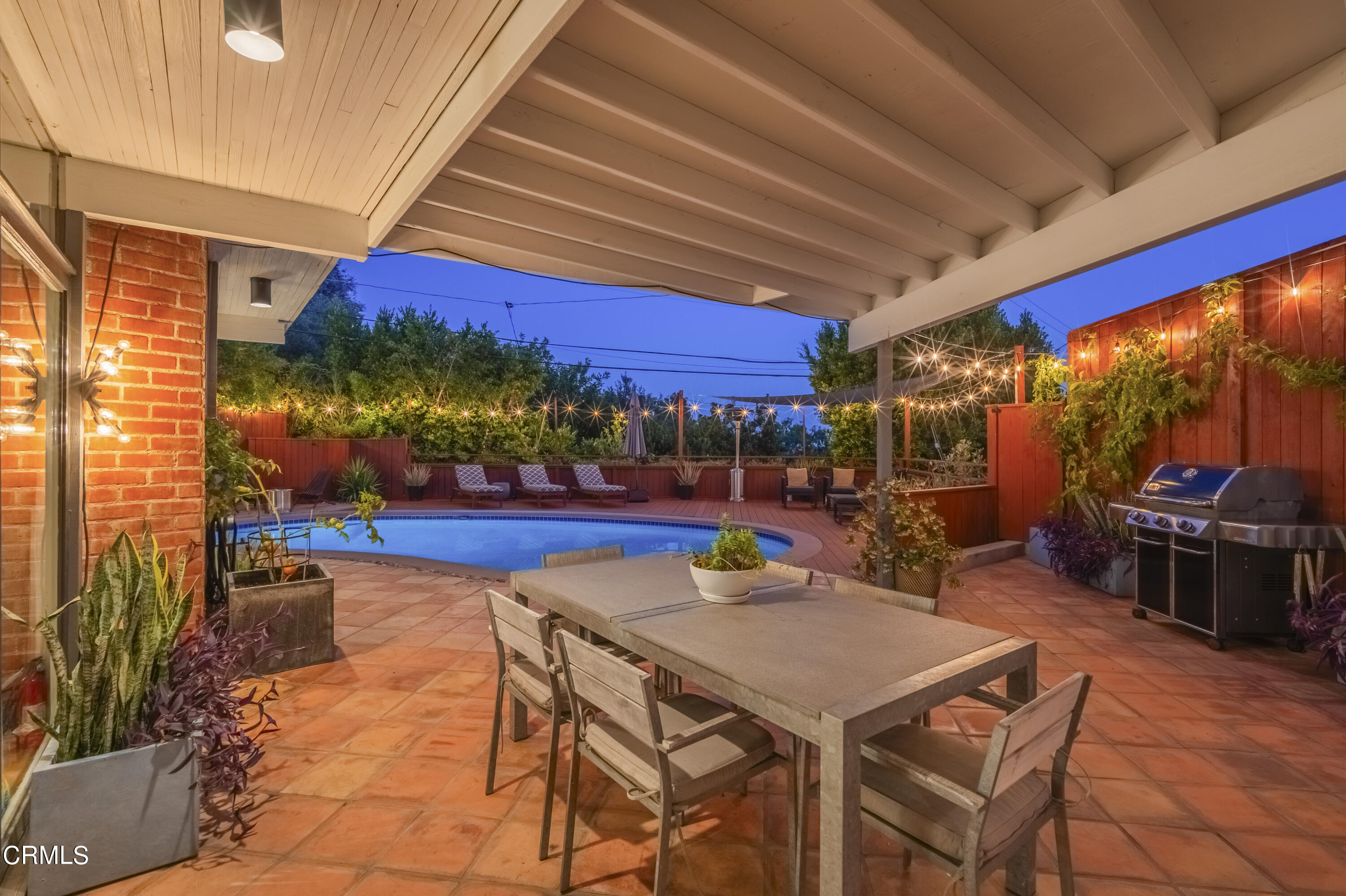 444 Sequoia Drive Pasadena, CA 91105 - Photo 35 of 38 a view of a patio with a table and chairs under an umbrella