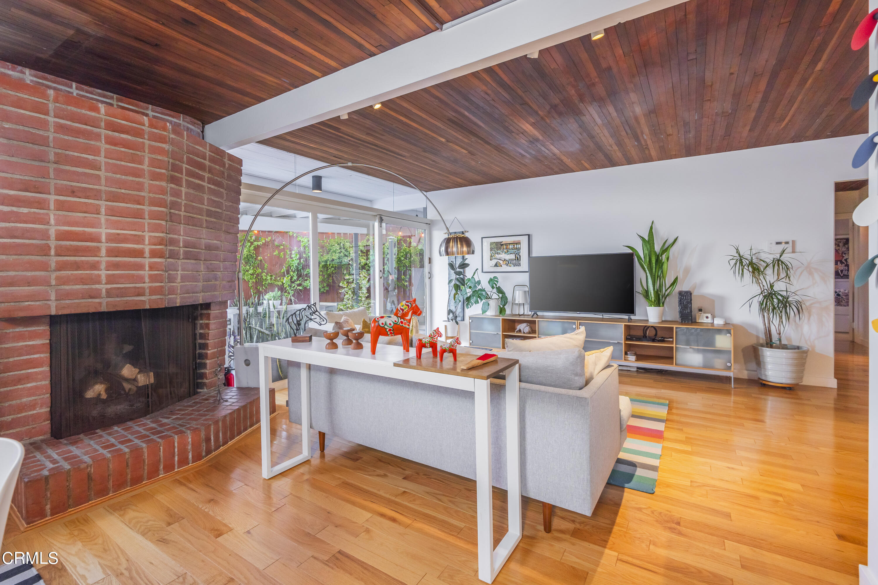 444 Sequoia Drive Pasadena, CA 91105 - Photo 5 of 38 a living room with furniture a fireplace and a flat screen tv