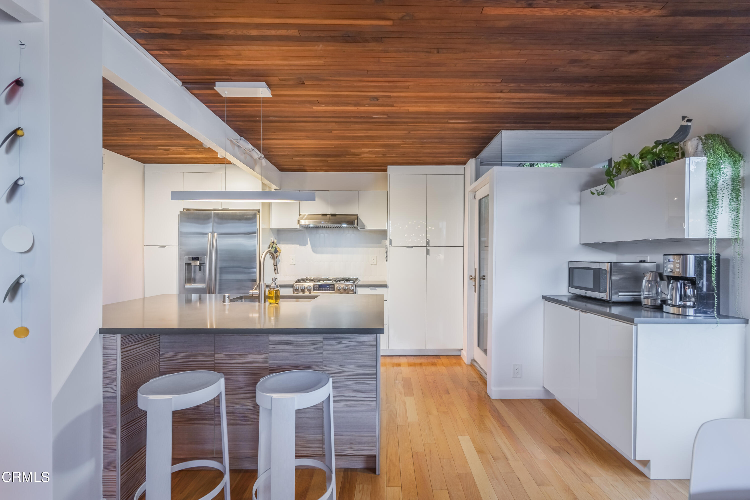 444 Sequoia Drive Pasadena, CA 91105 - Photo 7 of 38 a kitchen with cabinets and wooden floor