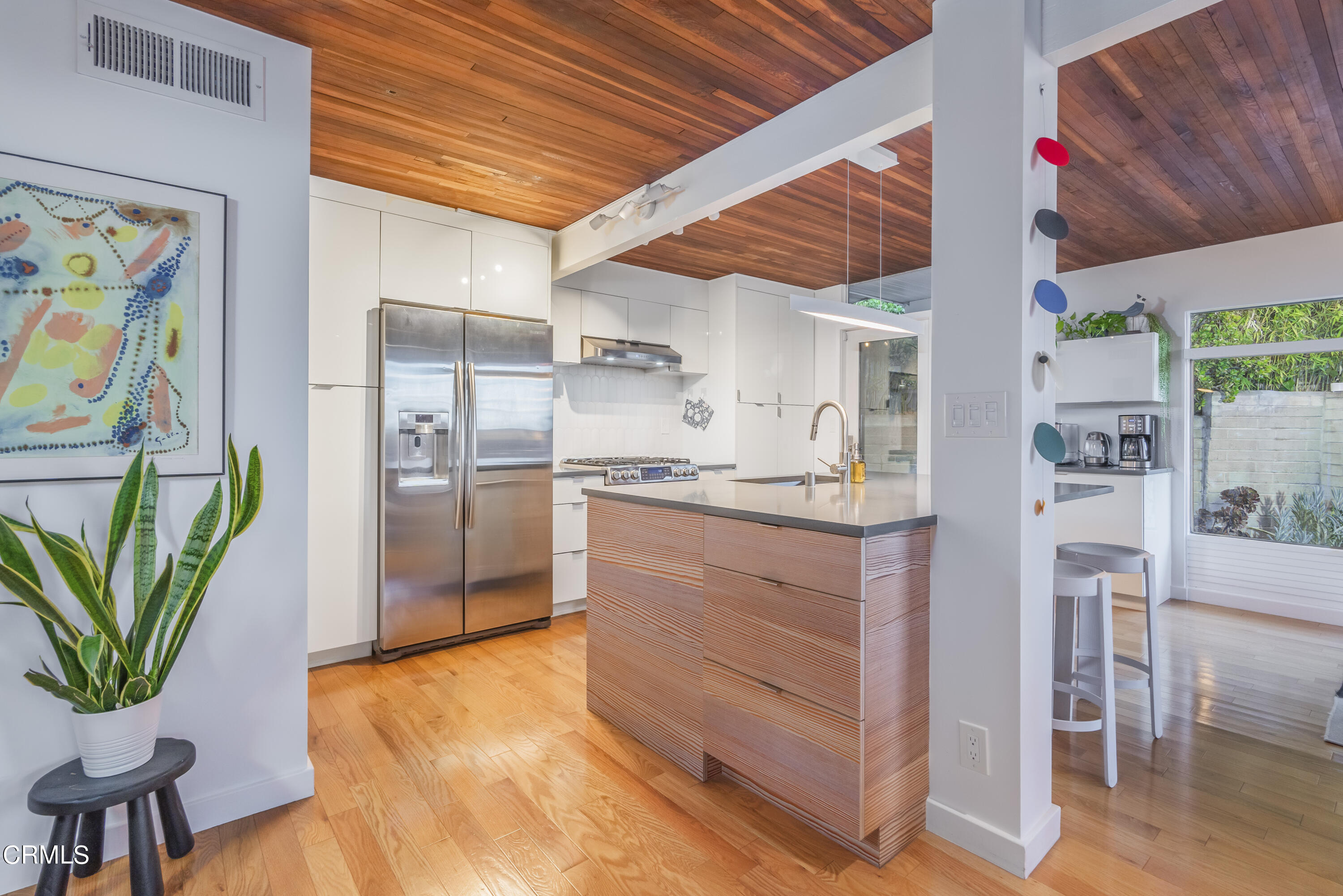 444 Sequoia Drive Pasadena, CA 91105 - Photo 8 of 38 a kitchen with stainless steel appliances kitchen island granite countertop a refrigerator and a stove