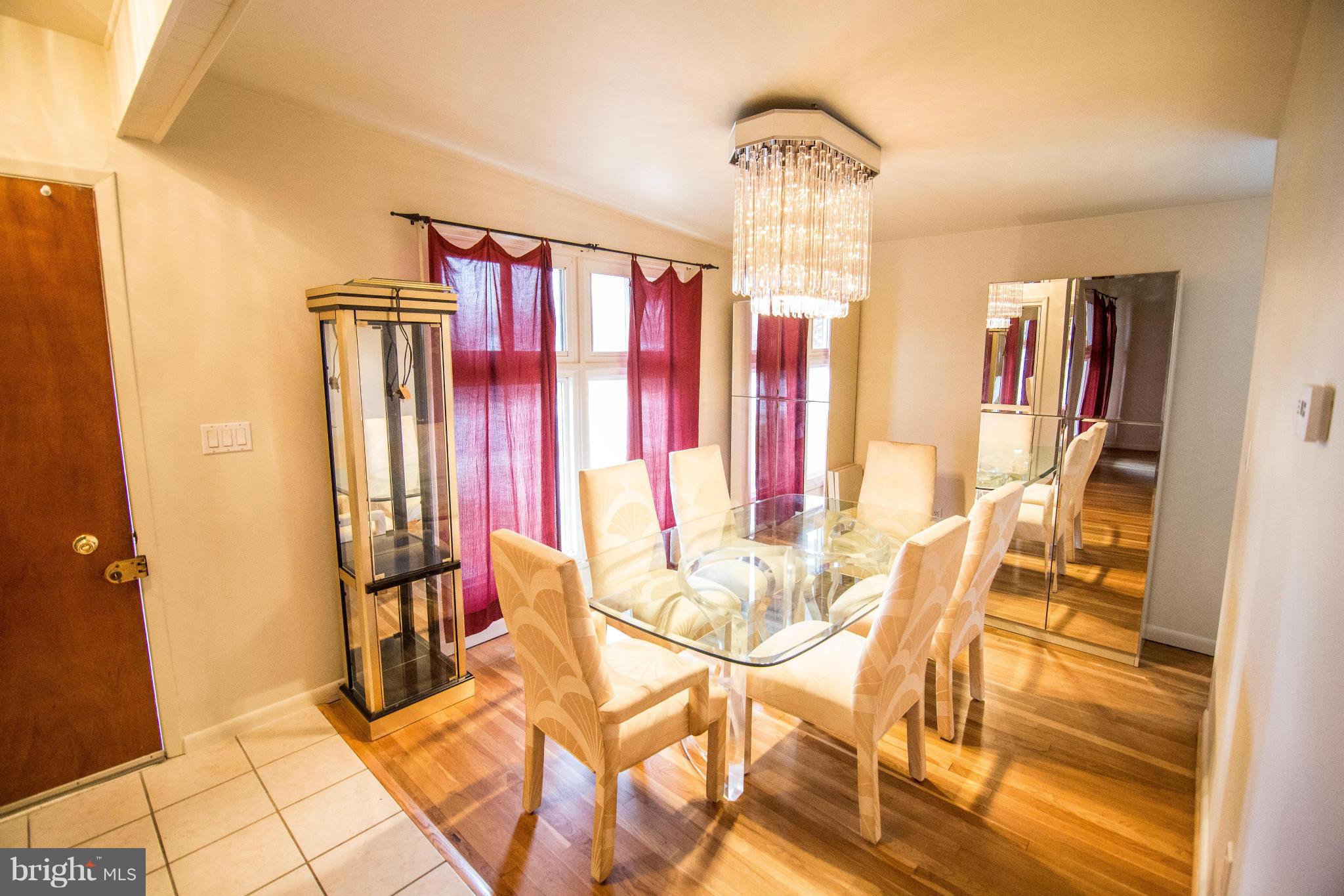 6834 Queens Ferry Road Baltimore, MD 21239 - Photo 2 of 21 Dining Room w/ nice light coming in