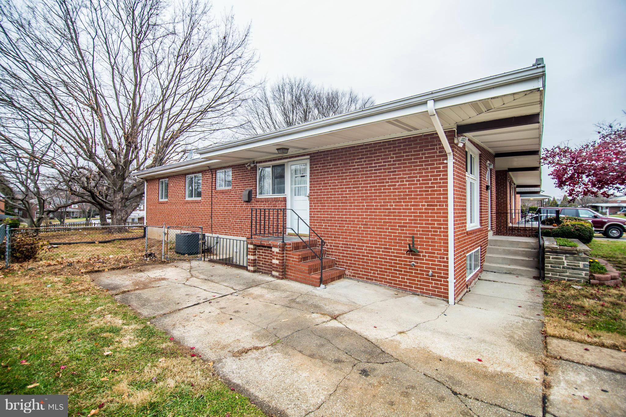 6834 Queens Ferry Road Baltimore, MD 21239 - Photo 20 of 21 Side View w/ Large Driveway