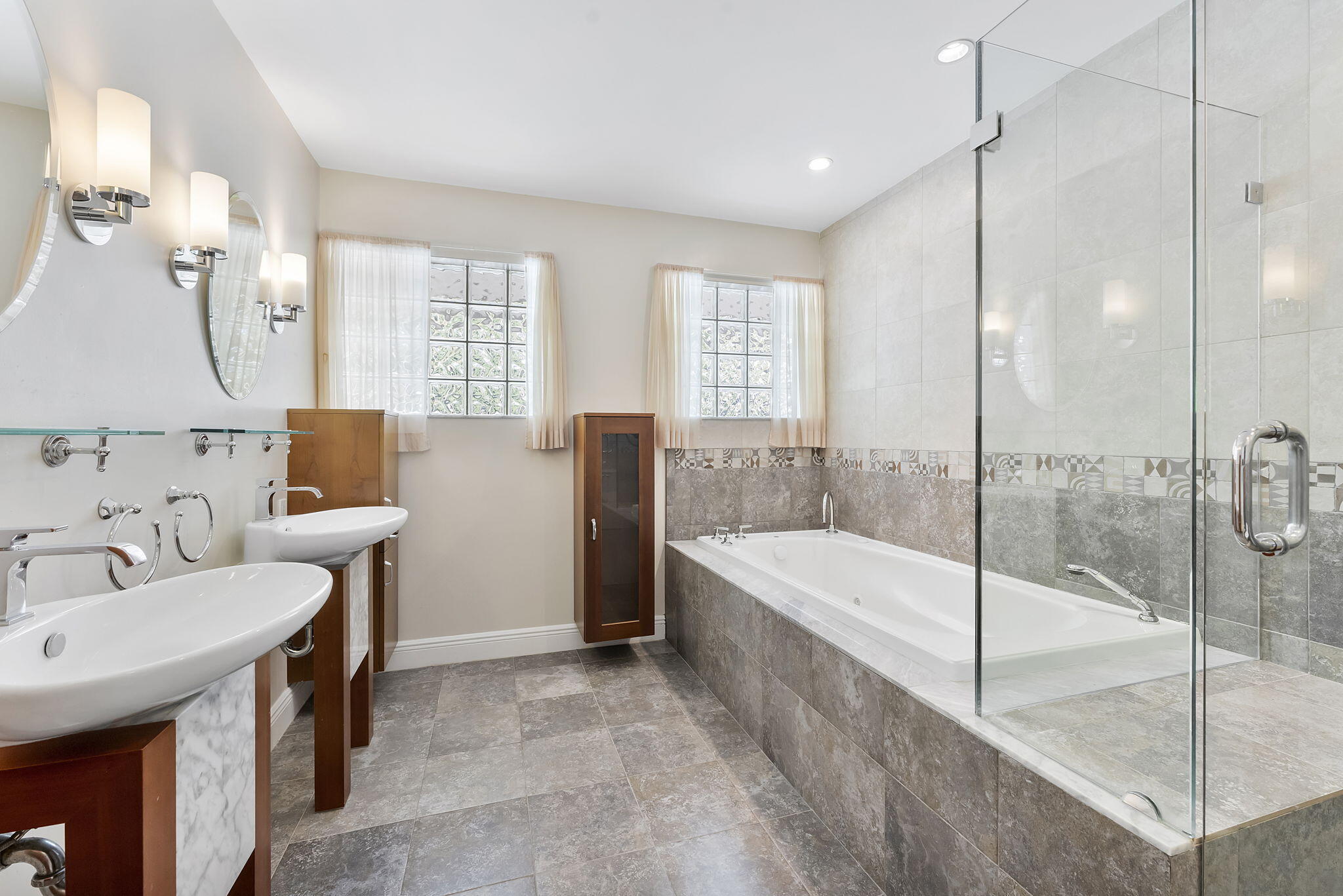 2415 Northwest 31st Street Boca Raton, FL 33431 - Photo 17 of 41 a bathroom with a tub sink and mirror