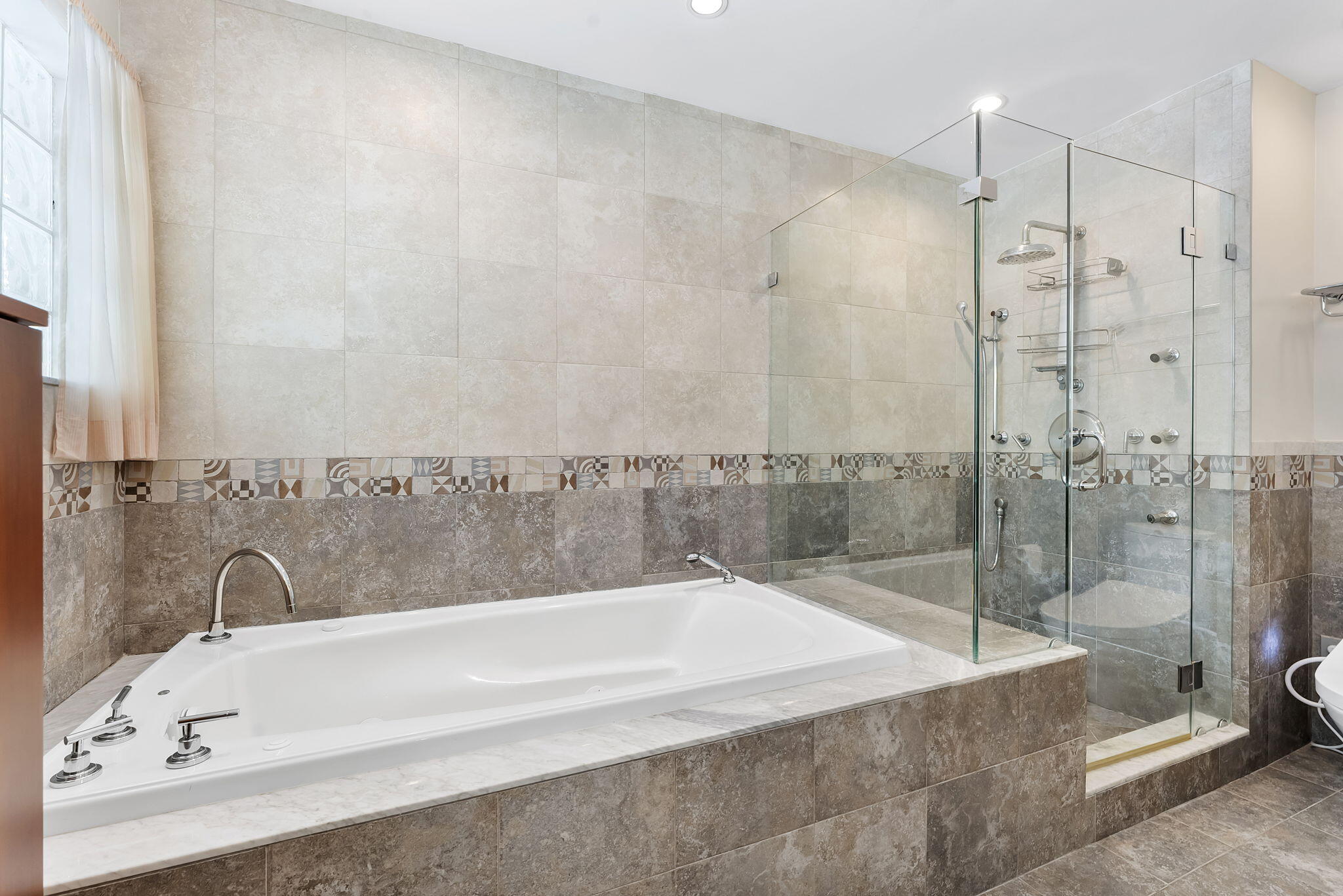 2415 Northwest 31st Street Boca Raton, FL 33431 - Photo 18 of 41 a bathroom with a bathtub and a shower