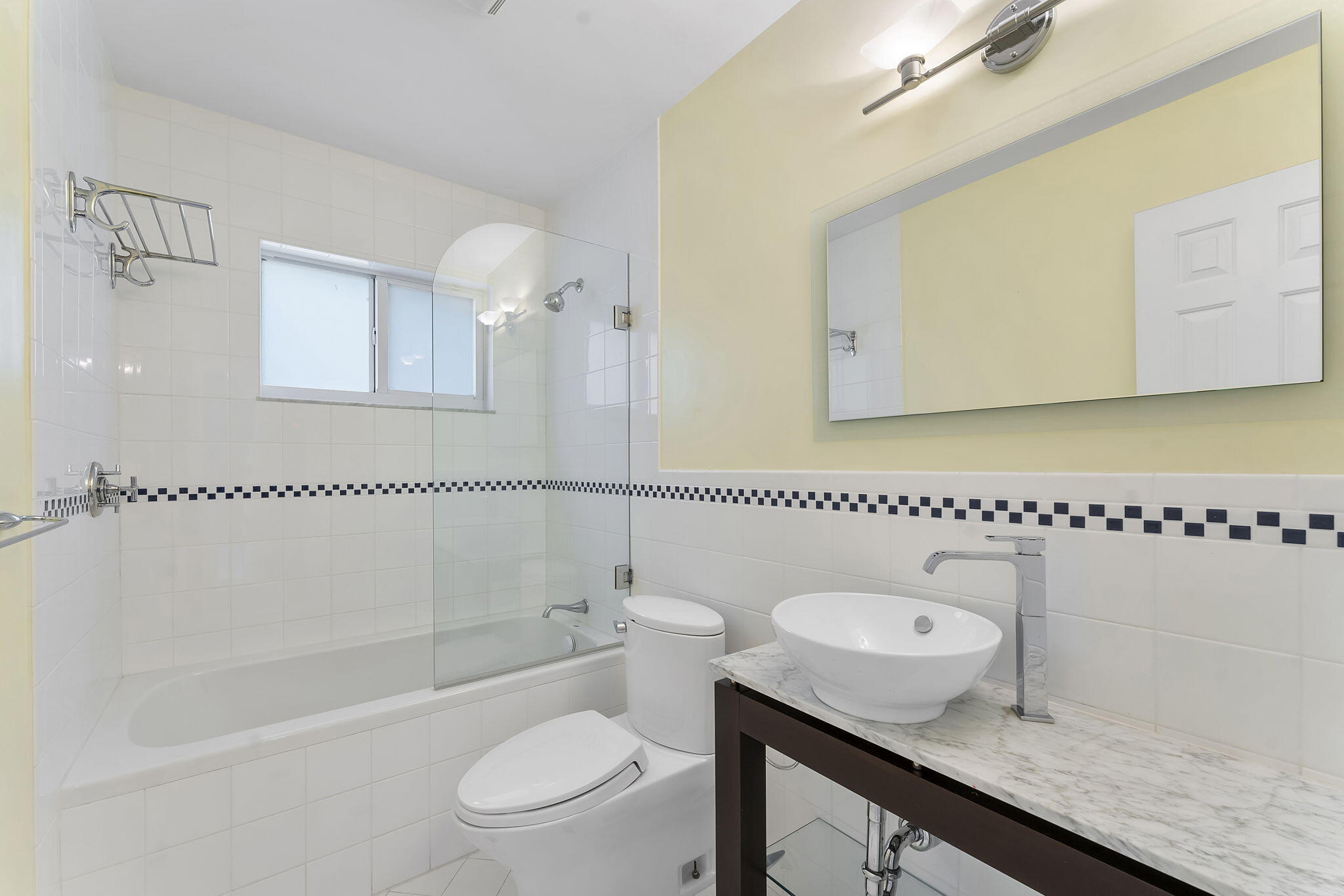 2415 Northwest 31st Street Boca Raton, FL 33431 - Photo 21 of 41 a bathroom with a granite countertop sink a toilet and shower