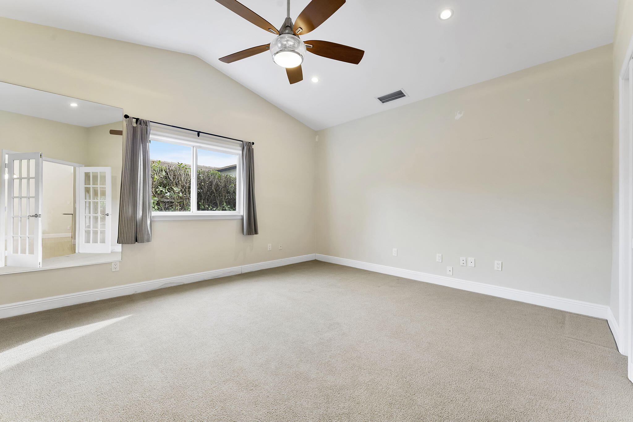 2415 Northwest 31st Street Boca Raton, FL 33431 - Photo 30 of 41 an empty room with windows and fan
