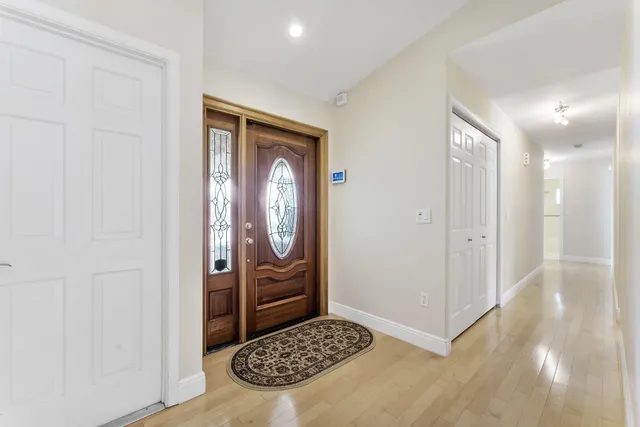 a view of cabinet with mirror and gate