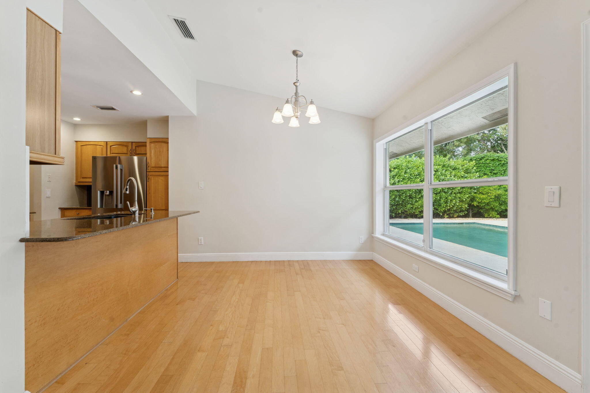 2415 Northwest 31st Street Boca Raton, FL 33431 - Photo 7 of 41 a view of a livingroom with a chandelier
