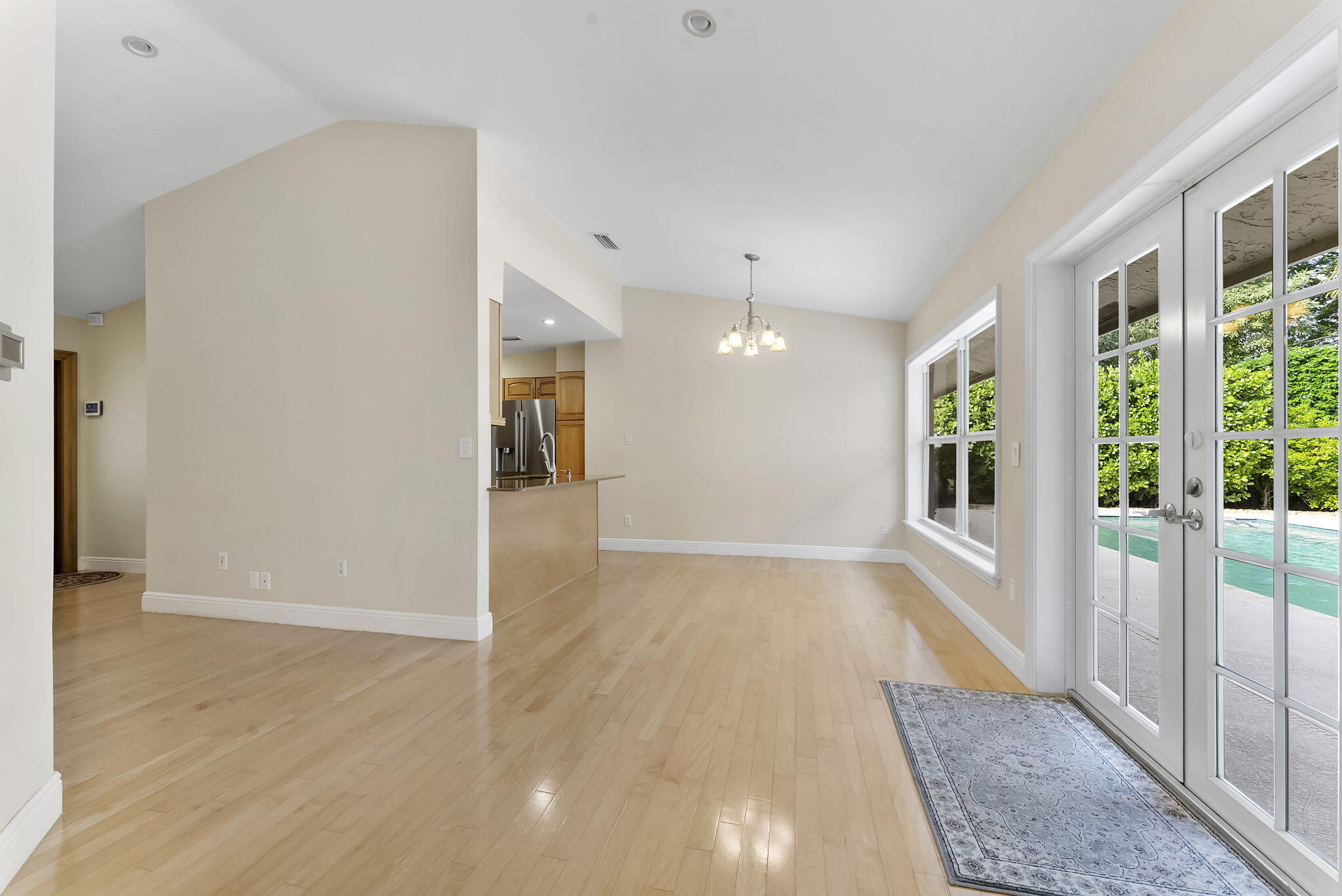 2415 Northwest 31st Street Boca Raton, FL 33431 - Photo 8 of 41 an empty room with wooden floor and windows