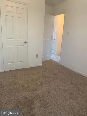 a bathroom with a toilet and a shower curtain