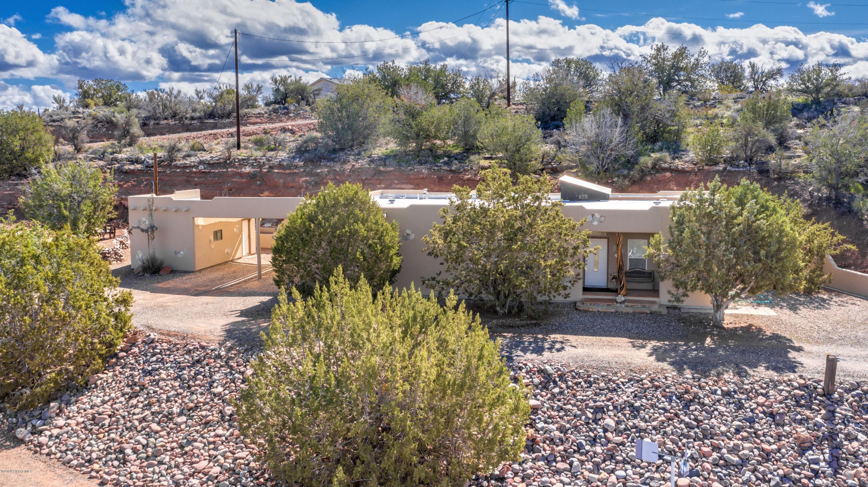 2995 North Coach Road Rimrock, AZ 86335 - Photo 5 of 25 a view of a house with a yard and sitting area
