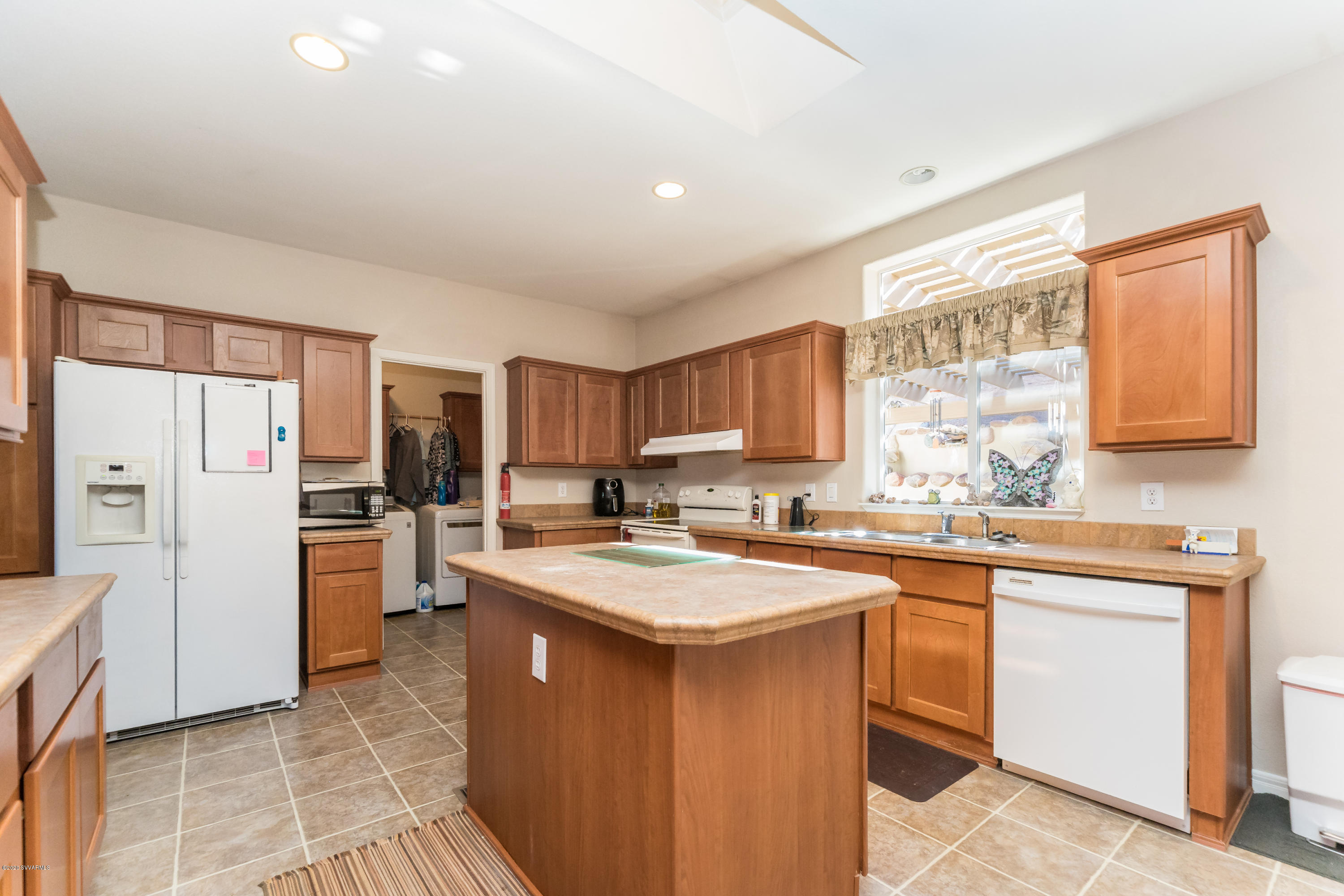 2995 North Coach Road Rimrock, AZ 86335 - Photo 8 of 25 a kitchen with a sink a counter top space stainless steel appliances and cabinets