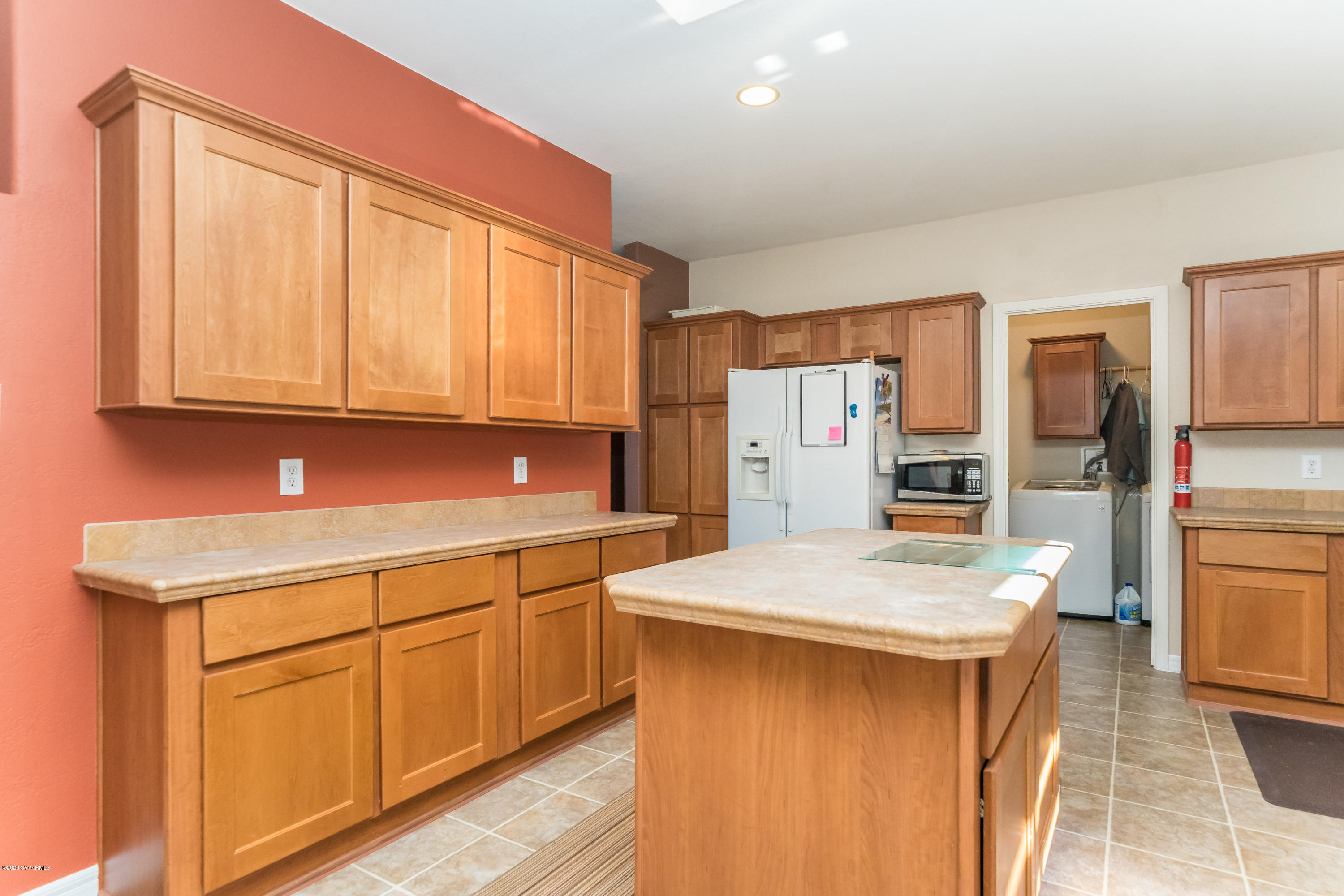 2995 North Coach Road Rimrock, AZ 86335 - Photo 9 of 25 a kitchen with stainless steel appliances kitchen island granite countertop a refrigerator and stove
