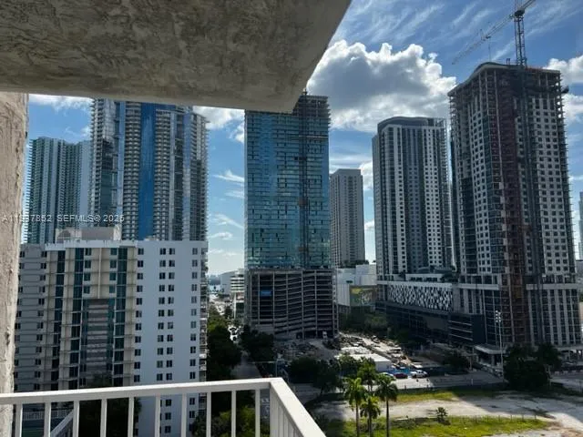 a view of swimming pool with outdoor seating