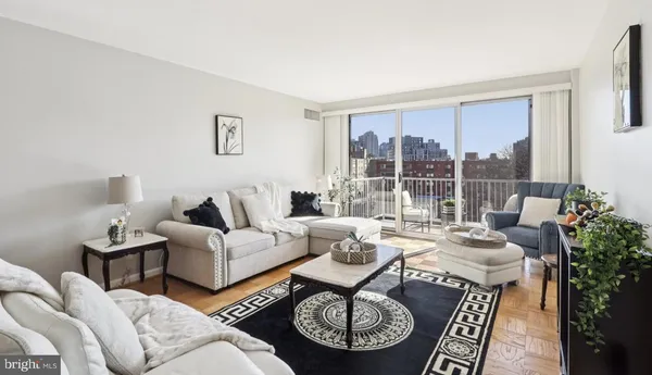 a living room with furniture and a large window