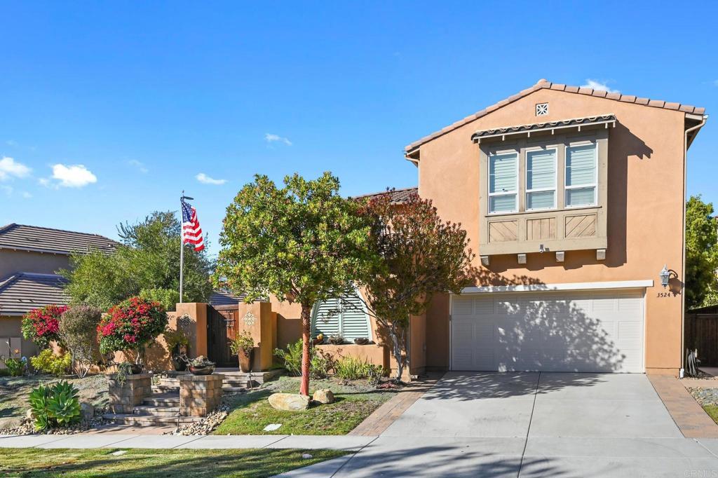 a front view of a house with yard