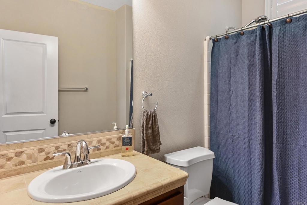 3524 North Fork Avenue Carlsbad, CA 92010 - Photo 16 of 37 a bathroom with a sink a toilet and shower