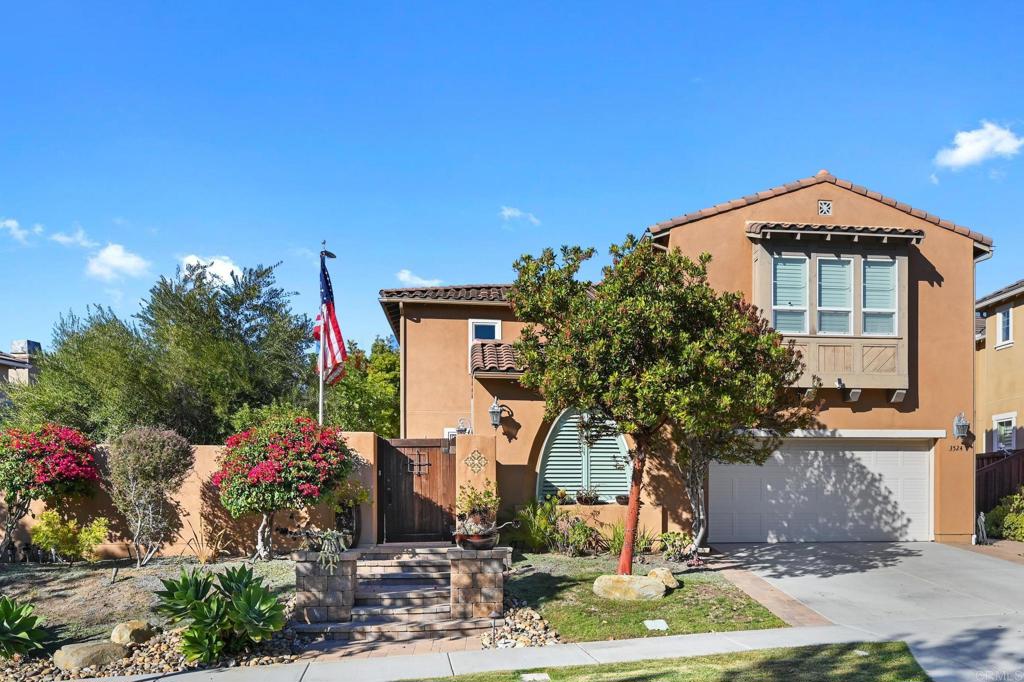 3524 North Fork Avenue Carlsbad, CA 92010 - Photo 2 of 37 a front view of a house with a yard