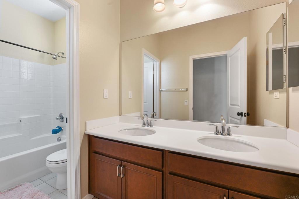 3524 North Fork Avenue Carlsbad, CA 92010 - Photo 28 of 37 a bathroom with a sink a toilet a tub and shower