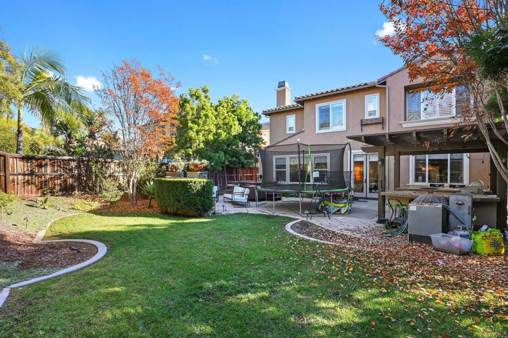 3524 North Fork Avenue Carlsbad, CA 92010 - Photo 30 of 37 a view of a house with backyard sitting area and garden