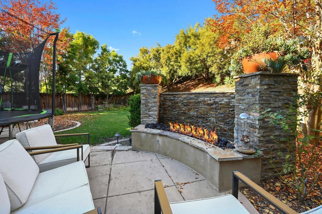 3524 North Fork Avenue Carlsbad, CA 92010 - Photo 33 of 37 a view of a patio with chairs and a yard