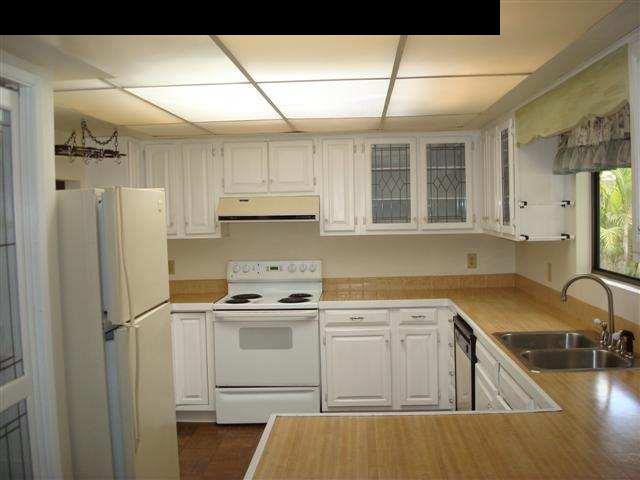 5019 Lower Kula Road Kula, HI 96790 - Photo 3 of 9 a kitchen with a sink stove and refrigerator