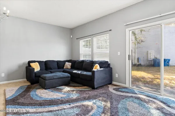a living room with furniture and a window