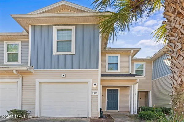 a front view of a house with a garage