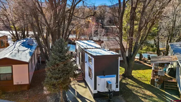 a kitchen with stainless steel appliances a stove a sink and a refrigerator