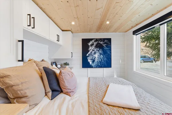 a bathroom with a sink and a wall clock