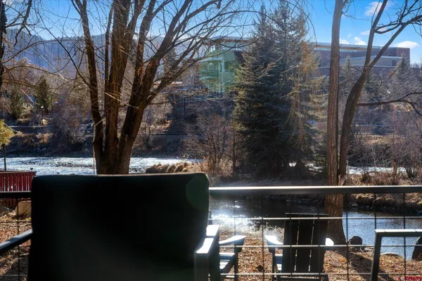 a view of a lake with houses and trees