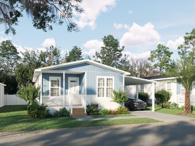 a front view of a house with a garden and trees