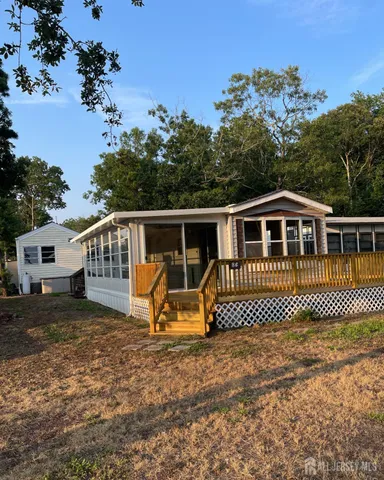 aerial view of a house with a yard